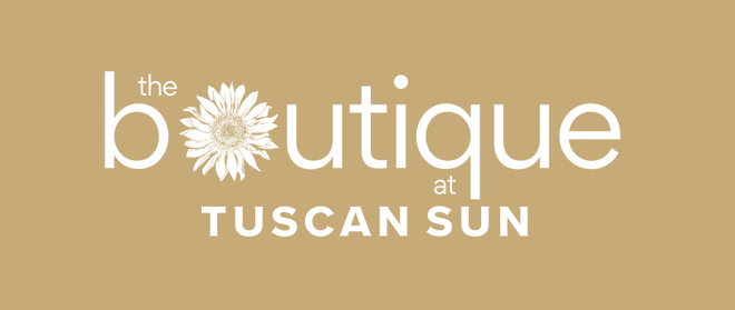 Logo of 'the boutique at Tuscan Sun' with a sunflower design on a beige background